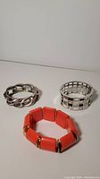All three bracelets together showing their size and design differences.