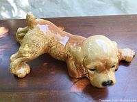 Side angle showing the full body of the porcelain Cocker Spaniel figurine with detailed fur texture and glossy finish.