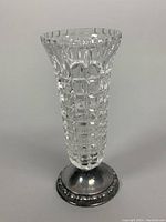 Full view of the 1950s cut crystal vase with flared top and footed silver base, showing clear geometric square pattern on the crystal body.