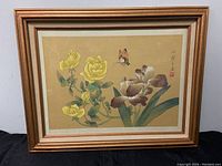 Full framed painting showing yellow roses, purple irises, and orange butterfly on silk.