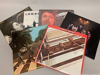 All six albums stacked side-by-side with front cover art visible showing The Beatles and others.