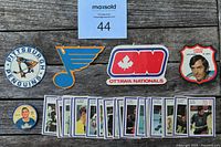 Lot layout showing Pittsburgh Penguins, St. Louis Blues, Ottawa Nationals logos, Jacques Caron player crest, and 30 rectangular stamps.