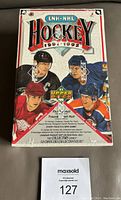 Front view of sealed 1991-92 Upper Deck hockey card wax box with images of NHL players and branding.