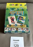 Front view of sealed 1992-93 OPC Premier hockey card wax box showing branding and card images under factory shrink wrap with PPO seals.