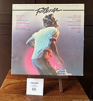 Front cover of Footloose Original Soundtrack LP featuring a person running and track listings.