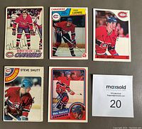 Photo showing all five signed Montreal Canadiens hockey cards with player images and autographs.