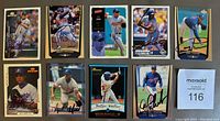 Lot of 9 autographed Montreal Expos baseball cards all signed in Sharpie. Cards include two of Vladimir Guerrero. Cards show players in various poses and uniforms.