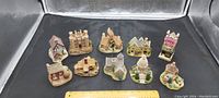 Top view showing all 10 miniature Lilliput Houses arranged with a ruler measuring their size.