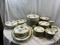 Overview of entire Noritake Glenlea set arranged on table showing tureens, platters, plates, bowls, cups and saucers.
