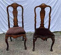 Front view of both chairs showing overall Queen Anne silhouette and marquetry