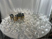Full tabletop view of assorted glass and crystal pieces