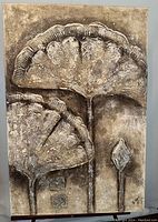 Full view of the signed textured oil painting showing two large fan-shaped leaves and a smaller leaf with rich texture and muted earthy tones.