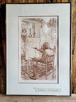 Full framed engraving showing the artwork of an artist painting a female nude model, including the matting and frame.