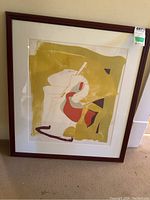 Full front view of framed abstract print showing shapes in yellow, red, grey and brown