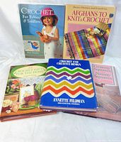 Front view of all five crochet books laid out showing colorful crochet-themed covers and title names.
