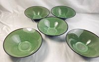 Top view showing five green bowls with Wasabi Fusion pattern and unique flared shape.