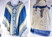 Blue and cream alpaca poncho with geometric pattern hanging next to Northern Reflections floral canvas tote bag with blue denim trim and woven rope handles.