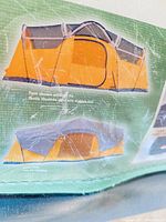 Photo showing the tent design with three rooms and front door with mesh windows.