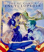 Front cover with artwork of various DC characters: Superman, Batman, Wonder Woman, The Joker, Catwoman, and others.