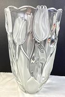Front view of clear crystal vase with embossed frosted tulip flowers and leaves.