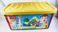 Front view of Mega Bloks large red and yellow tote box with product label showing 220 First Builders blocks for children 1 to 5 years old