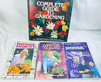 All four books displayed together on a flat white surface showing titles and covers.