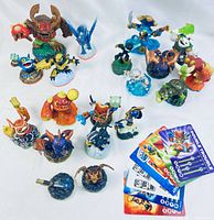 Wide shot showing the 19 Skylanders figures arranged in small groups with 6 character cards on the side.