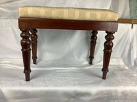 Side view showing seat and turned legs