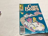 Front cover of Care Bears comic book issue #1 with bright cartoon illustration and blue background.