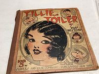 Front close-up of the 1930 Tillie the Toiler Comic Book No. 5 cover showing main female character illustration and smaller cartoon faces, title, and publisher info.