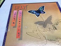 Front cover of Heart Dog and Butterfly album showing butterfly illustration and text