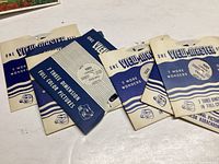 Seven original Viewmaster reels in their vintage blue and white sleeves with text and logos visible.