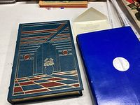 Blue leather bound book titled Summer's Lease with intricate geometric pattern on the cover.