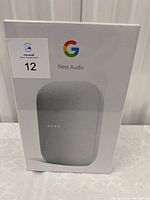 Photo showing front of the Google Nest Audio box with the product image and branding.