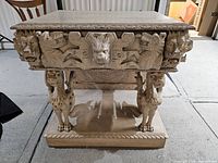 Front view of carved oakwood buffet with animal and mythical motifs