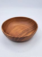 Top view of the vintage turned wood bowl showing interior surface and wood grain.