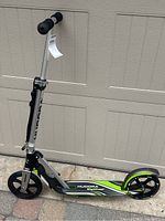 Full side view of the Hudora BigWheel scooter showing the frame, large front and rear wheels, and handlebar with grips.