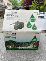 Photo of unopened box for Little Giant Submersible Pond Pump showing product specifications and label.