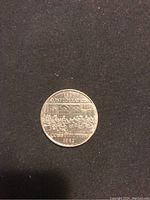 Front side of the coin showing the 135th Confederation with Constitution 1982 design