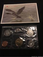 Photo shows six 1994 Canadian uncirculated coins in sealed blister pack with a protective envelope featuring geese artwork.