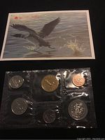 Photo of seven 1995 Canadian uncirculated coins in sealed blister pack alongside collectible Canada goose card.