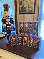 Group of nutcracker ornament boxes, some opened and some unopened, displaying various nutcracker designs and labeled 'CASSE-NOISETTE'.