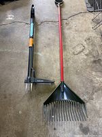 Photo of the Fiskars weed puller and plastic leaf rake showing their size and condition.