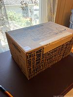 Boxed Hawaiian shaved ice machine, showing full packaging and brand name on top with product details.