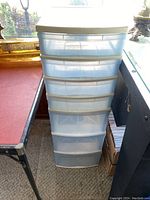 Front view of one Gracious Living storage drawer unit showing 7 transparent drawers stacked vertically with white frame and top surface.