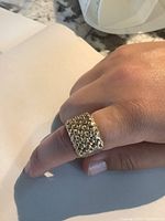 Front view showing rectangular head with granulated bead texture