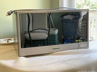 Full view of Panasonic microwave with power cord.