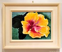 Framed oil painting featuring a bright yellow and red hibiscus flower with green leaves on canvas, signed lower right 'G. McDougall'.