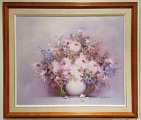 Frontal view of the original oil painting of floral still life in a white vase within vintage wood frame.