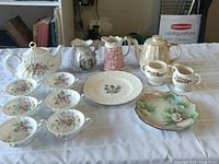 Overview of all items including teapots, tea cups, plates, and jugs.